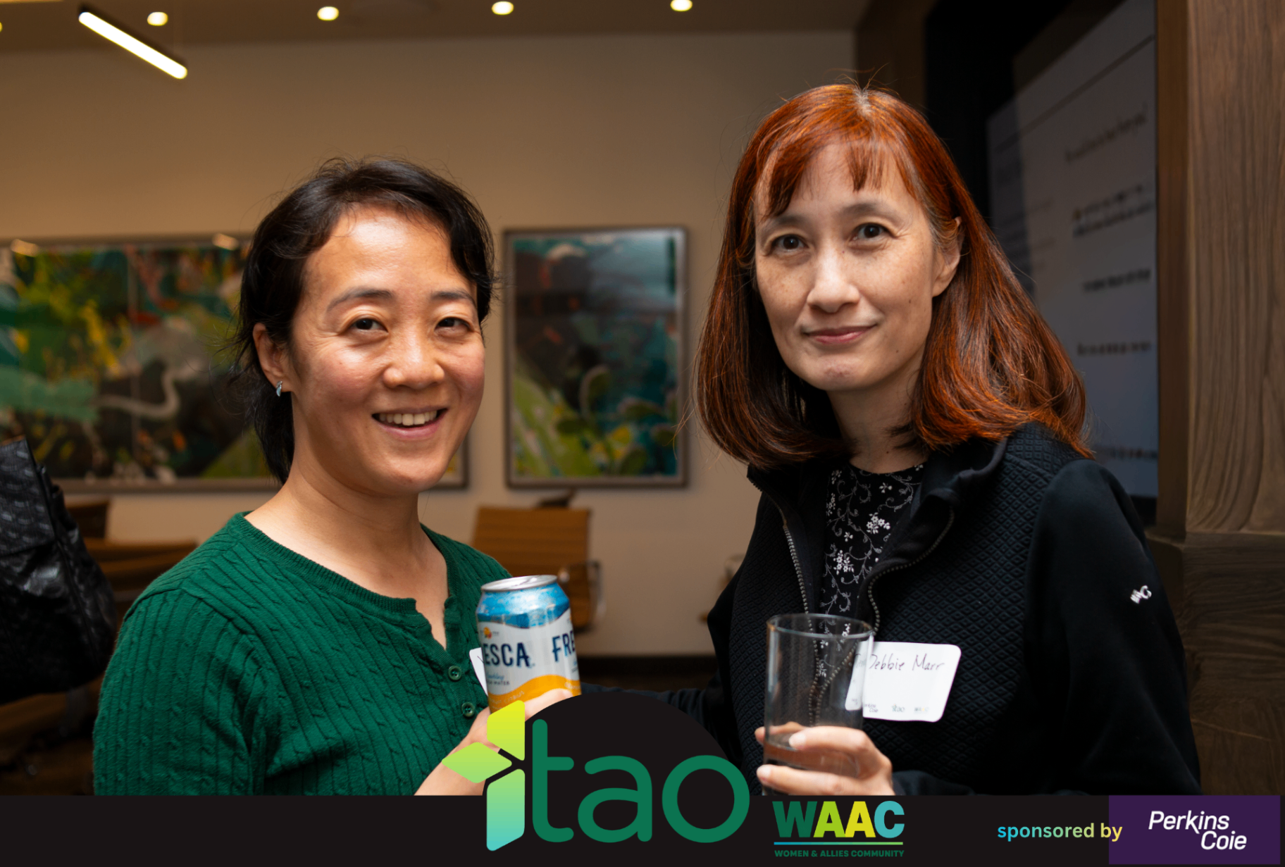 Two WAAC attendees standing together during the event.