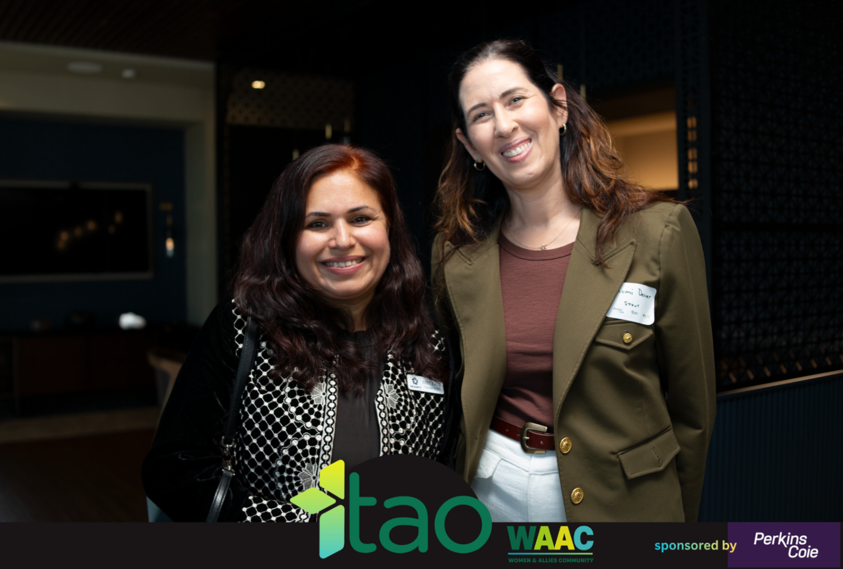 Two WAAC attendees posing together at the event venue.